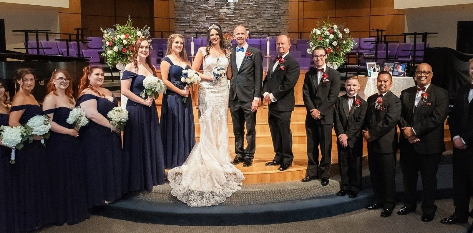 Family and wedding party gathered for a wedding portrait